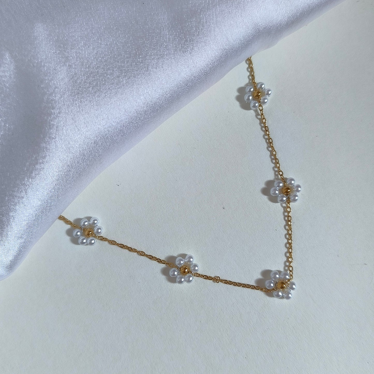 Anti-Tarnish Gold-Toned Chain with Multiple Floral Charms of Mini Pearls.