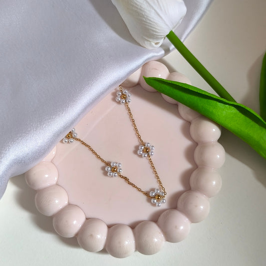 Anti-Tarnish Gold-Toned Chain with Multiple Floral Charms of Mini Pearls.