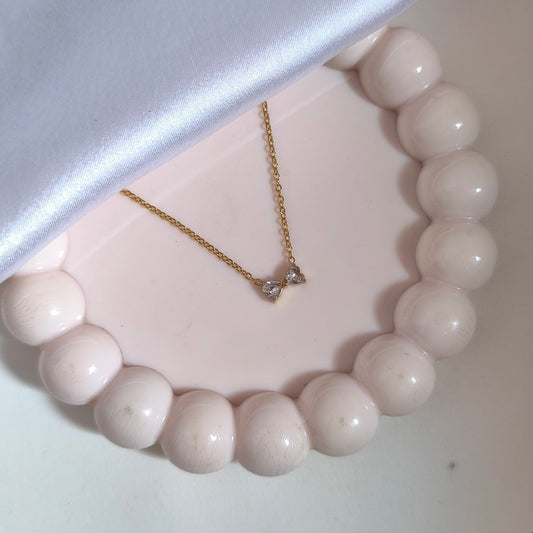 Anti-Tarnish Gold-Toned Chain with Crystal-Accented Bow Pendant.